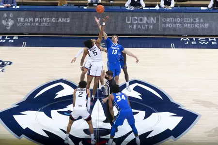 Isaiah Whaley jumps for the tip off to start the game against Creighton on December 20th 2020