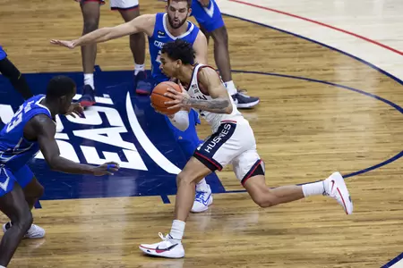 James Bouknight drives to the basket past the defender in the game against Creighton on December 20th 2020