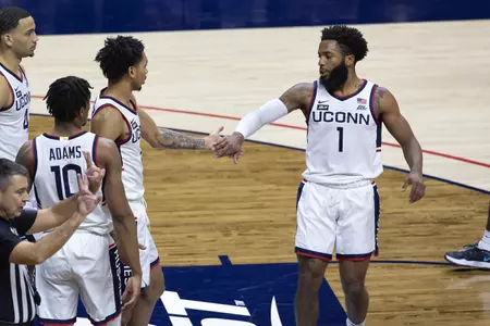 Rj Cole and James Bouknight high five each other in the game against Creighton on December 20th 2020