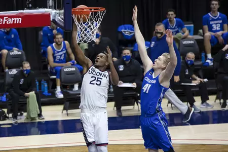 Josh Carlton makes the layup in front of the defender in the game against Creighton on December 20th 2020