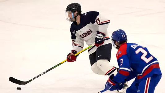 Marc Gatcomb looks to dish to a teammate against UMass Lowell on December 21, 2020.