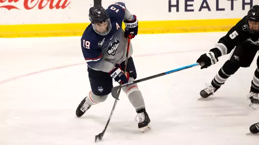 Brian Rigali rips a shot against Providence on December 28, 2020.