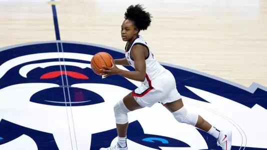 Christyn Williams dribbles across midcourt against DePaul on December 29, 2020.