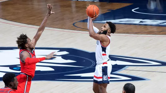 R.J. Cole shoots a three-pointer against St. John's on January 18.