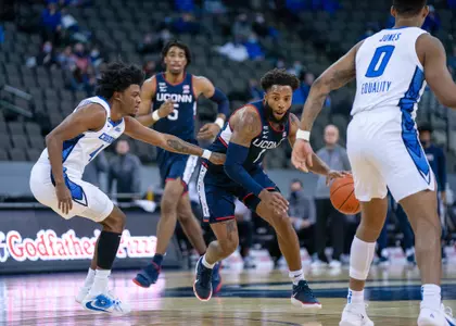 RJ Cole drives past a defender against Creighton on January 23, 2021