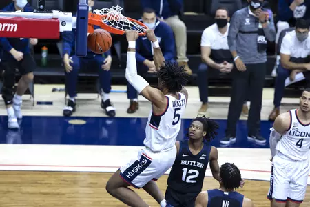 Isaih Whaley finishes a dunk against Butler on January 26th at Gampel Pavilion