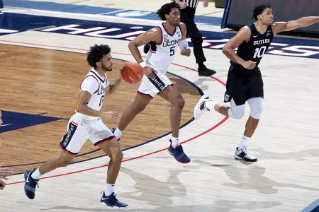 Jalen Gaffney dribbles the ball up the court in the game against Butler on January 26th at Gampel Pavilion