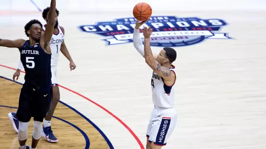 Tyrese Martin shoots a three-pointer against Butler on January 26, 2021.