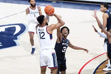 Tyler Polley pulls up and shoots the 3 in the game against Butler on January 26th at Gampel Pavilion