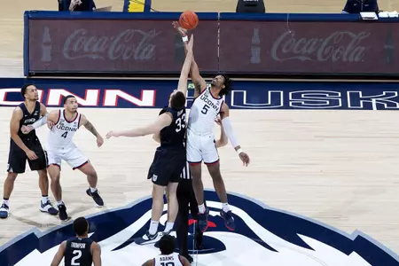 Isaiah Whaley jumps for the tip off in the game against Butler on January 26th at Gampel Pavilion