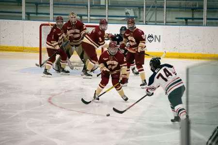 Emily Reid attempts a shot through traffic against BC on January 31, 2021.