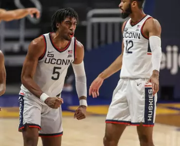 Isaiah Whaley celebrates after converting on a bucket for the Huskies against Marquette on January 5, 2021.