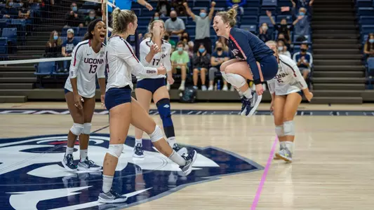 The volleyball team celebrating after a point against Creighton