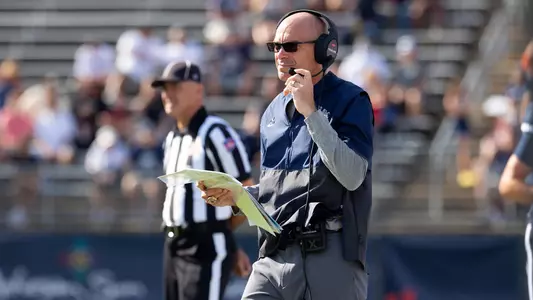 Lou Spanos on the sidelines during UConn's game against Purdue
