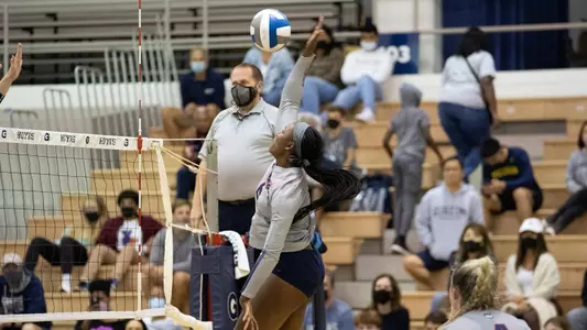 Kennadie Jake-Turner in the air about to attack the ball