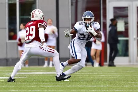 Nate Carter runs against UMass on October 9, 2021