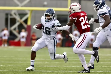 Nate Carter runs against UMass on October 9, 2021