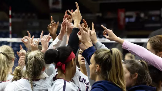 Volleyball in a team huddle