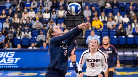 Caylee Parker preparing to dig the ball