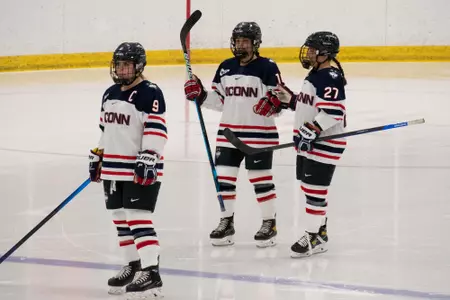 Players gather to talk at center ice before the faceoff