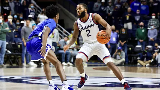 RJ Cole dribbles against CCSU on November 9, 2021