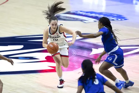 Nika Mühl drives past the defender in the game against Seton hall at gampel pavilion on February 10th
