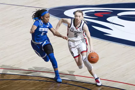 Paige Bueckers drives the lane in the game against Seton hall at gampel pavilion on February 10th
