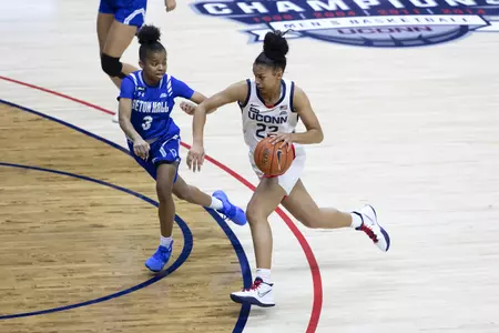 Evina Westbrook drives past the defender in the game against Seton hall at gampel pavilion on February 10th