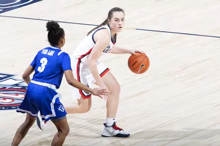 Nika Mühl dribbles against the defender in the game against Seton hall at gampel pavilion on February 10th