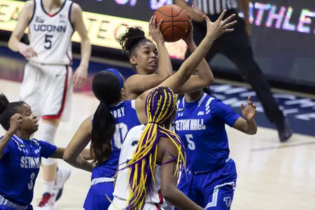 Evina Westbrook drives the lane through 3 defenders in the game against Seton hall at gampel pavilion on February 10th