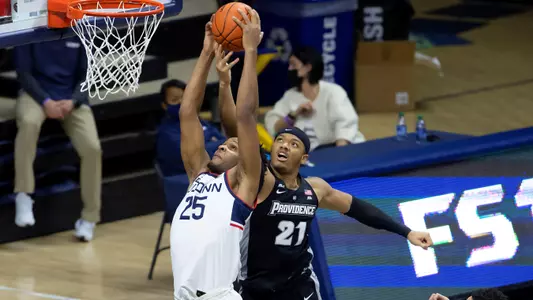 Josh Carlton grabs a rebound against Providence on February 16, 2021.