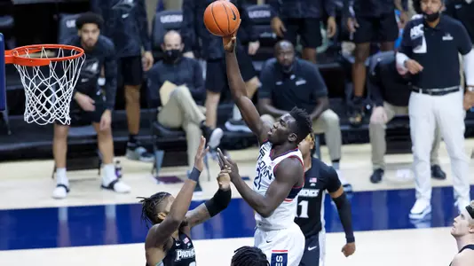 Adama Sanogo shoots a jump hook against Providence on February 16, 2021.