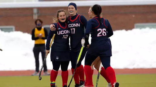 The Huskies celebrate following a goal against Hofstra on February 13, 2021.