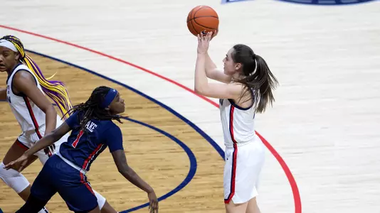 Nika Muhl shoots a three-pointer against St. John's on February 3, 2021.