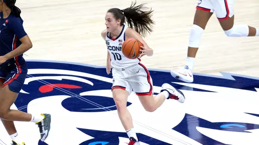 Nika Muhl dribbles across midcourt against St. John's on February 3, 2021.