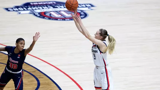 Paige Bueckers shoots a three-pointer against St. John's on February 3, 2021.