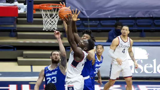 Adama Sanogo takes it up strong against Seton Hall on February 6, 2021.