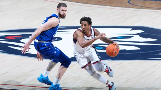 Brendan Adams drives to the basket against Seton Hall on February 6, 2021.