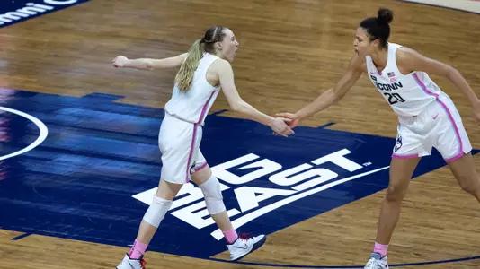 Paige Bueckers and Olivia Nelson-Ododa celebrate following the win against South Carolina on February 8, 2021.