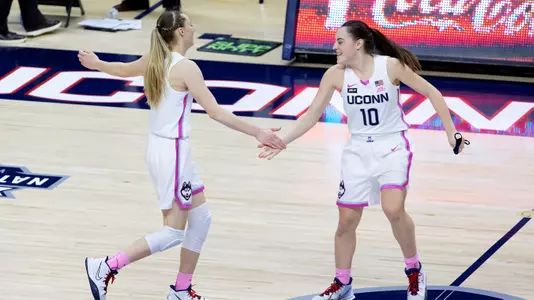 Paige Bueckers and Nika Muhl celebrate during the game against South Carolina on February 8, 2021.