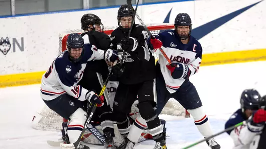 Jake Flynn and Adam Karashik during the Hockey East Quarterfinal matchup against Providence on March 14, 2021.