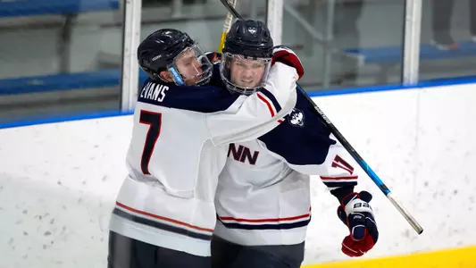 Jonny Evans and Jachym Kondelik celebrate following a UConn goal during the Hockey East Quarterfinal matchup against Providence on March 14, 2021.
