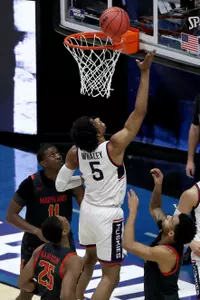 Isaiah Whaley shoots a layup