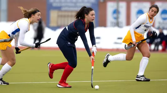 McKenna Sergi looks for a teammate Sophie Hamilton controls the ball against Hofstra on February 13, 2021.