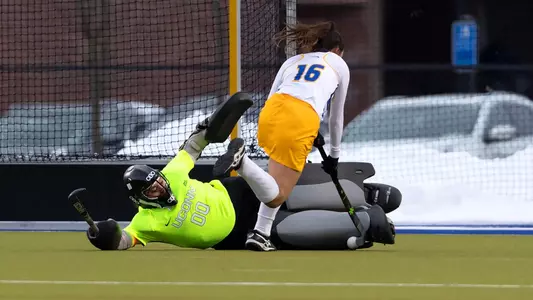 Cheyenne Sprecher makes a save Sophie Hamilton controls the ball against Hofstra on February 13, 2021.