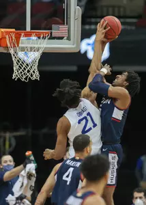 Isaiah Whaley goes up for a rebound