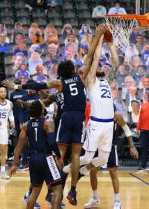 Isaiah Whaley goes up for a block