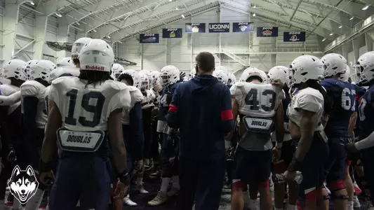 Randy Edsall addresses the team after a spring practice session