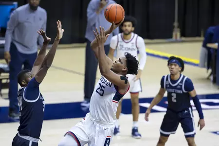 Josh Carlton rises for the floater in the game against Georgetown at Gampel Pavilion on March 6th 2021