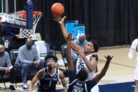 Josh Carlton rises for the shot in the game against Georgetown at Gampel Pavilion on March 6th 2021